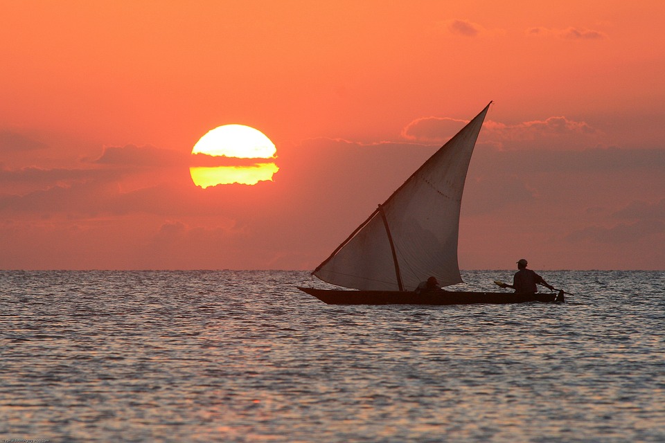 Traditional dhow boats at sunset